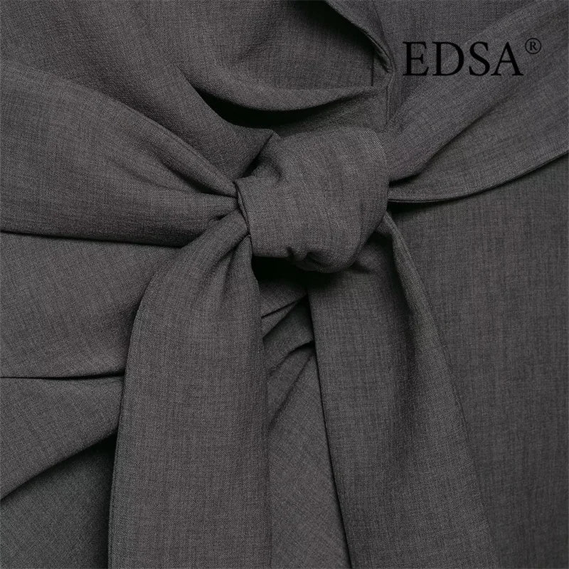 Close-up of a grey linen fabric bow tie, modern and elegant texture, EDSA logo visible