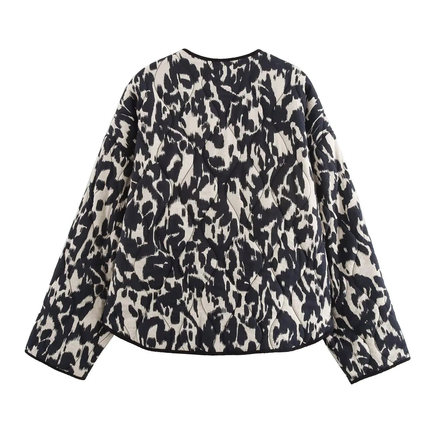 Black and white animal print quilted jacket with long sleeves, back view.