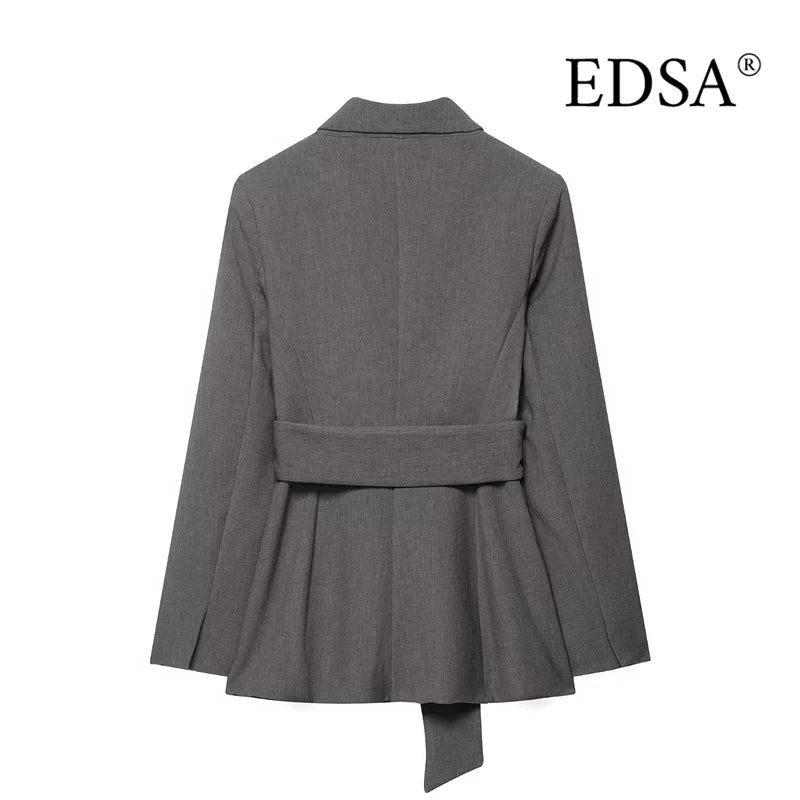 Back view of a tailored grey women's blazer with waist belt and flared hem