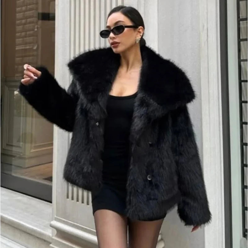 Woman wearing black faux fur coat, black sunglasses, and mini dress in chic urban setting