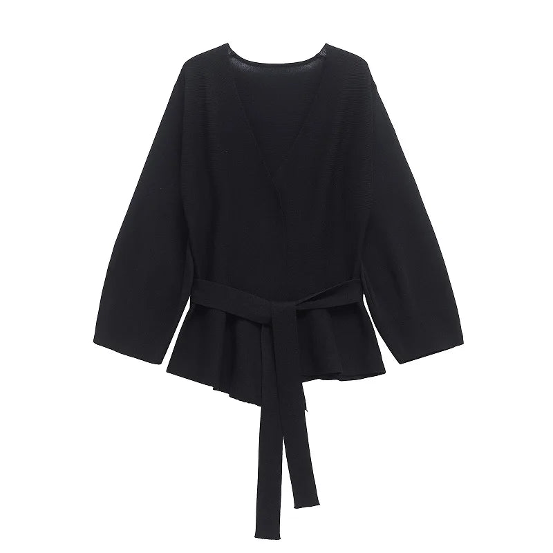 Elegant black long sleeve belted blouse with a V-neck and peplum hem for women