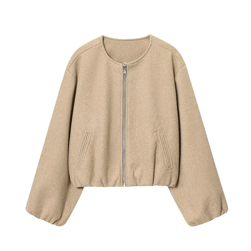 Women's beige wool zip-up jacket with long sleeves and side pockets, modern style